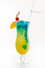 Exotic cocktail with orange and cherry on a light background