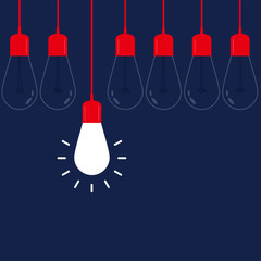 Hanging light bulbs with glowing one on navy background 