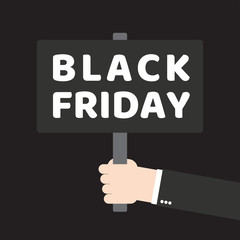 Human hands holding plate with word black friday