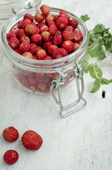 Wild strawberry in glass jar