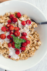 Granola with yoghurt and wild strawberries