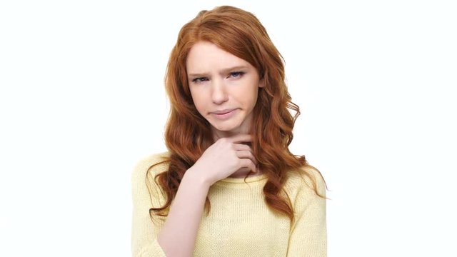 Young sick woman with red hair suffering from sore throat sickness isolated over white background