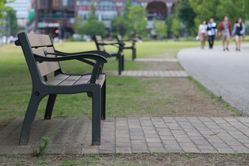 View of the benches beside the park sidewalk