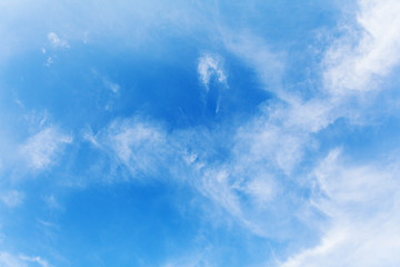 Fototapeta na wymiar Beautiful white clouds soar across the screen over a deep blue background.