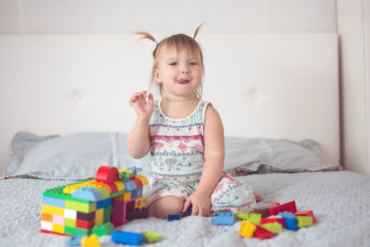 Toddler with tails play with constructor lifestyle