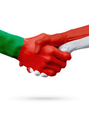 Flags Portugal, Monaco countries, partnership friendship handshake concept.