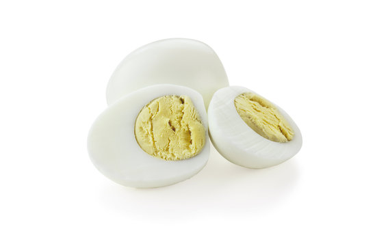 Cut out hard boiled eggs isolated against a white background with shadow. Clipping path included.