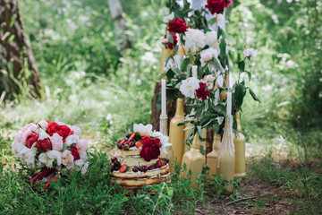 Wedding decor with flowers and bottle candles