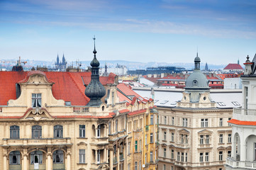 Fototapeta na wymiar Panoramic view of Prague. Beautiful towers of the historic buildings in perspective. Czech Republic