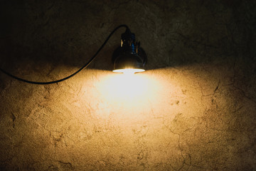 Lamp on the old wall