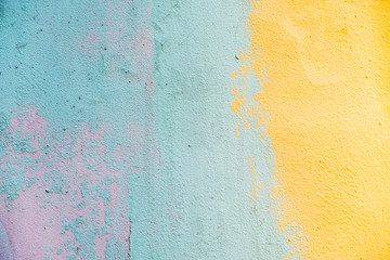 Colorful peeling old painted wall, bright colors