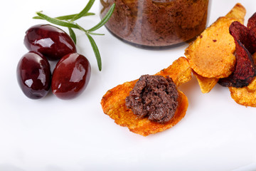 Tapenade - olive paste made from kalamata olives and vegetable chips.
