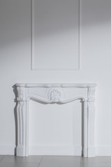 White fireplace in the white interior