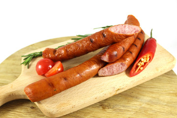 Grilled sausages with rosemary and hot peppers