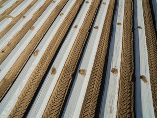 aerial view of asparagus fields covered with white plastic foil in the spring season - germany
