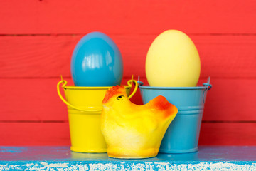 Colored eggs on wooden background, selective focus image. Happy Easter Card - space for text