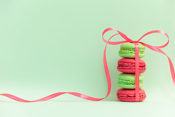 Macaroons or macaroni tied by ribbon on retro style pop art background. Free space for text