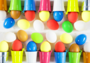 Colored eggs on wooden background, selective focus image. Happy Easter Card - space for text