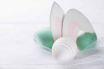 Easter eggs with cute rabbit ears, easter background, small depth of field