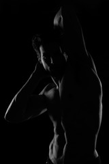 Obraz na płótnie Canvas Strong Athletic Man Fitness Model Torso showing big muscles