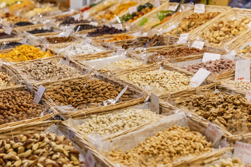 Nuts and dried fruits are sold in the market in Florence