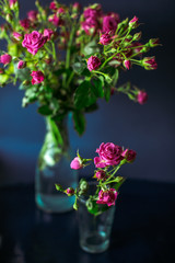 The beautiful vases with flowers  stand on the table