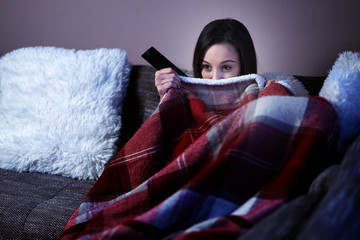 Woman watch horror film in TV