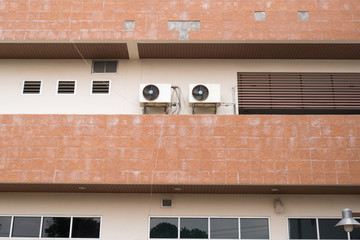 Condensing unit of the air conditioner at the second floor of a building