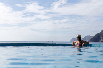 Brunette with glasses at pool