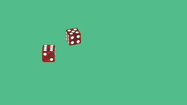 Red dice on green screen