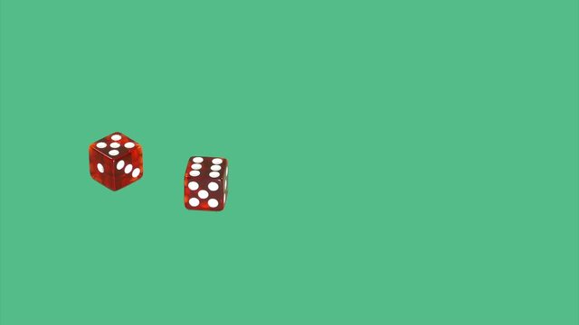 Red dice on green screen