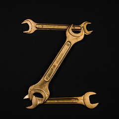 Letter Z. Alphabet made of golden repair tools