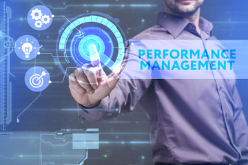 Business, Technology, Internet and network concept. Young businessman working on a virtual screen of the future and sees the inscription: Performance management