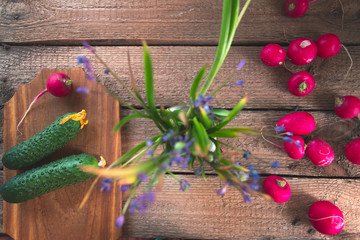 Still life of a cucumber radish on a wooden background.