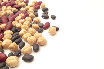 Mixed beans on white background - chickpea, kidney bean, and black bean