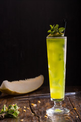 Cocktail with white rum, liqueur a green melon, syrup banana, pineapple juice
