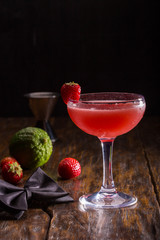 Cocktail with ice, strawberry and a lime with vodka