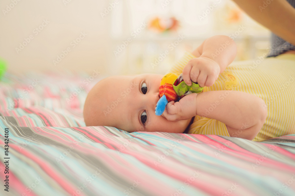 Poster cute boy laying with toy