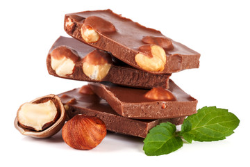 Chocolate with hazelnut and mint leaf isolated on white background