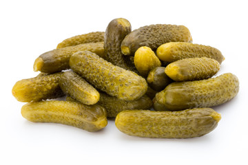 Marinated pickled cucumbers isolated on the white.