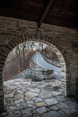 stone arch of outdoor shelter along road