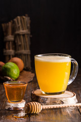 A hot mix about brandy, liqueur, amaretto, orange juice, honey and a lime