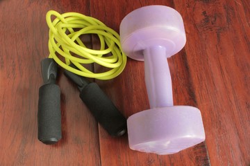 jump rope gymnastics and plastic dumbbells