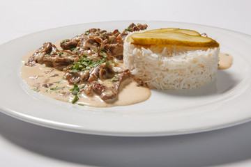 stewed meat with white rice and mashroom sauce