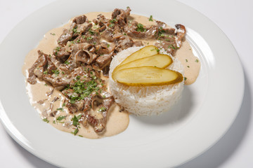 stewed meat with white rice and mashroom sauce