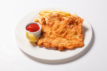 Fried fish and chips on the white plate