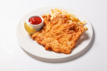 Fried fish and chips on the white plate