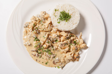 stewed chicken with white rice and mashroom sauce