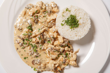 stewed chicken with white rice and mashroom sauce