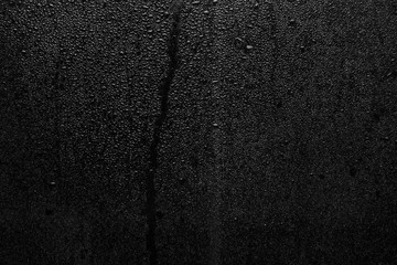 Part of series. Background photo of rain drops on dark glass, different size: small medium and large